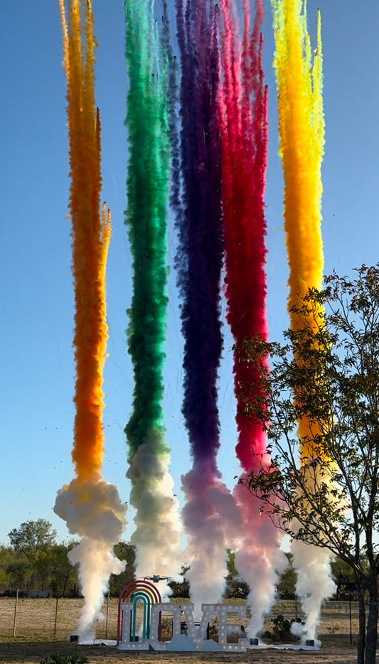 larger streams of thick huge colored smoke pillars rising into the sky orange green purple red yellow smoke trails